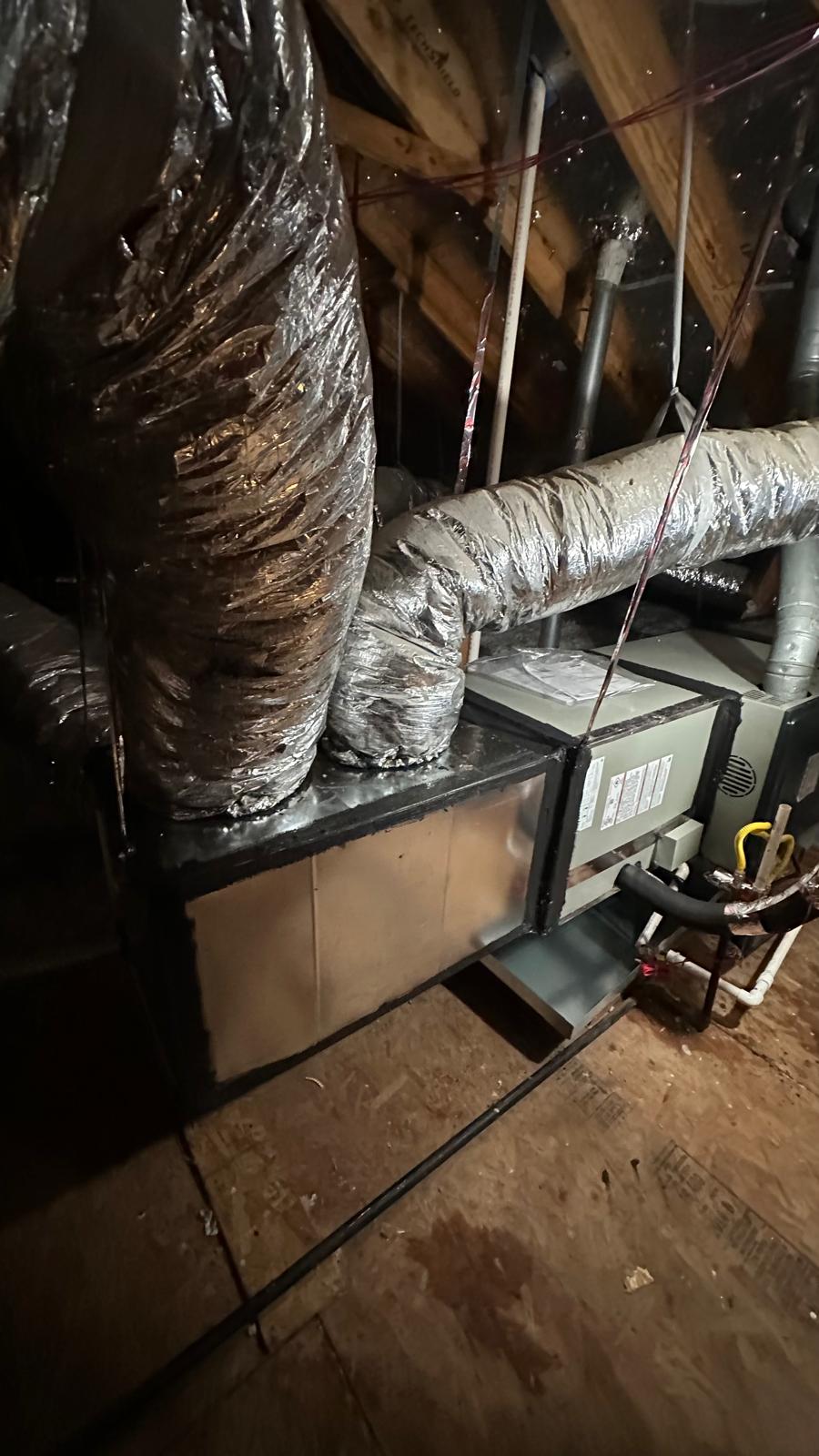 Attic HVAC equipment connected to insulated ductwork